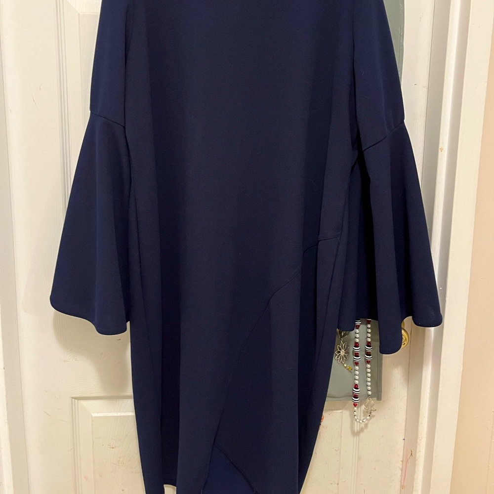 Navy blue church dress with cute accent bottom middle, bell sleeves, boat neck.